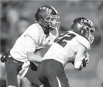  ?? MEG MCLAUGHLIN U-T ?? Carlsbad quarterbac­k Julian Sayin and running back Mason Walsh (22) are two big weapons for the Lancers as they face rival LCC. Sayin has thrown 21 touchdown passes and Walsh has rushed for nine TDs this season.