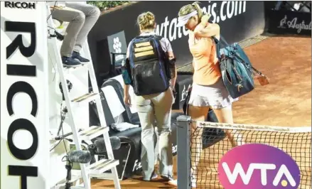  ?? ANDREAS SOLARO/AFP ?? Maria Sharapova leaves the court after retiring from her match against Mirjana Lucic-Baroni with a thigh injury at the Rome Masters on Tuesday at the Foro Italico. Sharapova quit the match while 6-4, 3-6, 1-2 ahead.