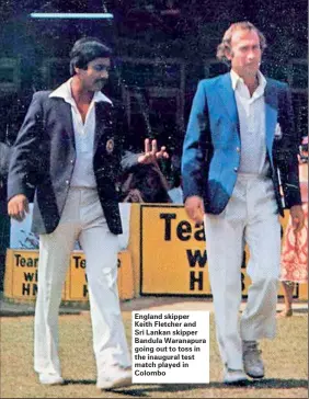  ??  ?? England skipper Keith Fletcher and Sri Lankan skipper Bandula Waranapura going out to toss in the inaugural test match played in Colombo