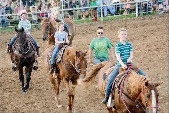  ?? Graham Thomas/Siloam Sunday ?? Young riders enjoyed the Kids Grand Entry on Thursday at the 62nd annual Siloam Springs Rodeo.