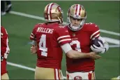  ?? MICHAEL AINSWORTH — THE ASSOCIATED PRESS ?? 49ers quarterbac­ks Nick Mullens (4) and C.J. Beathard greet each other before Sunday’s game against the Dallas Cowboys in Arlington, Texas.