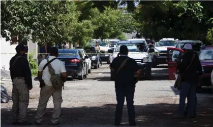  ?? ?? Police officers guard the area where Antonio de la Cruz was killed in Ciudad Victoria. Photograph: Reuters