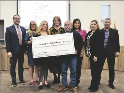  ?? PHOTO BY SISKO J. STARGAZER ?? SOMERTON EDUCATION INC. PRESENTED $21,829.25 TO SOMERTON HIGH SCHOOL during YUHSD’S February governing board meeting. Pictured from left are Somerton High Principal Lucky Arvizo, YUHSD board member Christy Cradic, Somerton Education Inc. Chair Helen Anaya, YUHSD board member Shelley Mellon, YUHSD Board President David Lara, Somerton Education Inc. Secretary Lorena Delgadillo, Somerton Education Inc. member Maribel Marin and YUHSD Board Vice President Carlos Gonzalez.