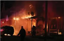  ?? COURTESY OF FLEETWOOD FIRE COMPANY ?? A three-alarm fire engulfs multiple homes in the 100 block of East Locust Street in Fleetwood on April 16, 2020.