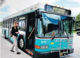  ?? CARLINE JEAN/SUN SENTINEL ?? Kayleigh O’Connell of Delray Beach boards a Palm tran bus near the Town Center Mall in Boca Raton. Beach County’s bus system, is changing its routes for the first time in 20 years.