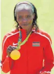  ?? FOTO: DPA ?? Jemima Sumgong mit ihrer Marathon-Goldmedail­le.