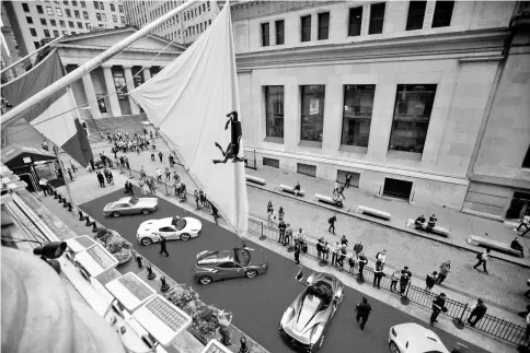  ??  ?? Ferraris sit parked in front of the New York Stock Exchange in New York on Oct 9. — WP-Bloomberg photo