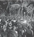  ?? DANIEL A. VARELA/MIAMI HERALD VIA AP ?? A police vehicle cuts through crowds near Ocean Drive during spring break in Miami Beach, Florida, on Saturday.