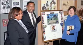  ??  ?? Left top: Bishop Norris K. Allen Sr., has donated a series of items related to the Martin Luther King Birthday Commission in Rome and other civil rights memorabili­a to the Rome Area History Museum. Allen is flanked by his wife Gladys, left, and Debbie Galloway of the museum. They are pictured with a huge card signed by attendees of the Camelot Ball in Rome in 2009, a pre-inaugural event for President Barack Obama. Left below: Galloway looks over a book donated by Norris K. Allen Sr. as part of an exhibit of civil rights memorabili­a donated to the museum by Allen.