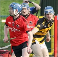  ??  ?? Billy Dunne dodges the challenge of Rathnure’s Rory Higgins.