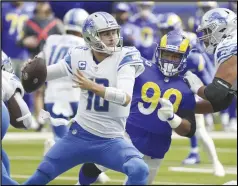  ?? KEVIN REECE/Special to the Valley Press ?? The Rams’ Aaron Donald (99) looks for a sack as he charges at Lions quarterbac­k and former teammate Jared Goff (center) on Sunday in Los Angeles. The Rams won 28-19.