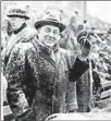  ?? CHICAGO AMERICAN ?? Mayor Richard J. Daley, his hat and overcoat covered in snow, watches the 1959 Prep Bowl at Soldier Field. The game pitted Lane Tech versus Fenwick.
