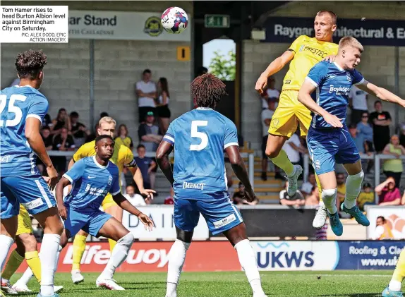  ?? PIC: ALEX DODD, EPIC ACTION IMAGERY. ?? Tom Hamer rises to head Burton Albion level against Birmingham City on Saturday.