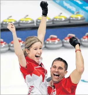  ?? AP PHOTO/AARON FAVILA ?? Canada’s Kaitlyn Lawes, left, and John Morris celebrate after winning their mixed doubles curling finals match against Switzerlan­d at the 2018 Winter Olympics in Gangneung, South Korea, Tuesday. Canada won the gold medal.