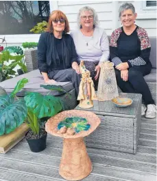  ?? ?? From left are Margaret Foley, Robyn Smaller and Donna Hitchcock with some of the pottery they’ll have for sale.
