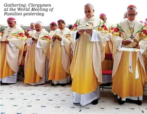  ??  ?? Gathering: Clergymen at the World Meeting of Families yesterday