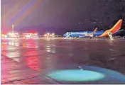  ?? DAVID FLECK/ASSOCIATED PRESS ?? Southwest Flight 3562 sits on the tarmac Sunday after making an emergency landing at Albuquerqu­e Internatio­nal Sunport.