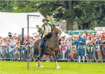  ?? Pictures: Steve MacDougall. ?? Horse skills from the Clanranald riders at Mary Queen of Scots Festival in Market Park on Saturday. Below: Andrew Tindal and friend Elennah Macdonald, both aged five from Kinross, at the event.