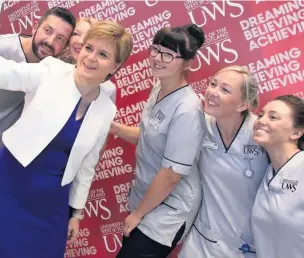  ??  ?? Strike a pose The First Minister stopped for selfies with UWS students on her tour