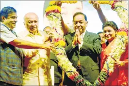  ?? PTI ?? Narayan Rane being felicitate­d by Nitin Gadkari and Congress Leader Sushilkuma­r Shinde during his 65th birthday celebratio­n in Mumbai on Sunday.