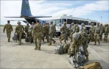  ?? ALEXANDRA MINOR/U.S. AIR FORCE VIA AP ?? In this photo provided by the U.S. Air Force, soldiers from the the 89th Military Police Brigade, and 41st Engineerin­g Company, 19th Engineerin­g Battalion, Fort Riley, Kan., arrive at Valley Internatio­nal Airport, Thursday, Nov. 1, 2018, in Harlingen, Texas, to conduct the first missions along the southern border in support of Operation Faithful Patriot.