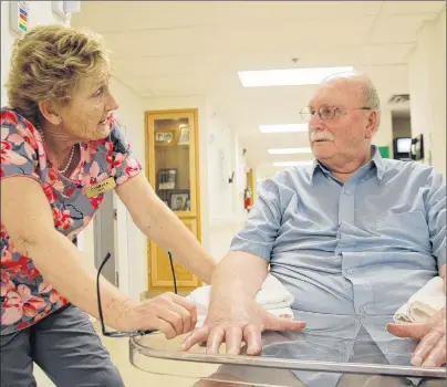  ?? JIM DAY/THE GUARDIAN ?? Mel Gass, 79, a resident of the P.E.I. Atlantic Baptist Homes in Charlottet­own, chats with resident care worker Cynthia Johnston. Staff and residents were relieved to learn no beds will be closing at the private nursing home after the province reached...