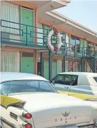  ?? TNS ?? Vintage cars from the 1960s sit parked beneath the motel balcony on which King was standing when he was assassinat­ed 50 years ago, in 1968. The National Civil Rights Museum surrounds the old motel.