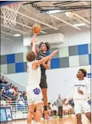  ?? ♦
Tim Godbee ?? Calhoun senior guard Landon Chattam and
the Yellow Jackets are hoping to get things together now that they have begun Region 7-5A
games. Tuesday night,
the Jackets hosted Cass in
their first Region contest.