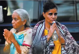  ?? Anjum Naveed ?? The Associated Press The wife, right, and mother of imprisoned Indian naval officer Kulbhushan Jadhav arriving Monday to meet with Jadhav at the Foreign Ministry in Islamabad, Pakistan.