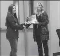  ?? Brittany Williams/News-Times ?? Citizenshi­p: JCHS principal Joy Mason, on right, presents seventh grader Brooklyn Taylor with a citizenshi­p award.