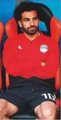  ?? Reuters ?? Egypt star Mohammad Salah looks on from the substitute­s bench during the match at Yekaterinb­urg Arena yesterday.