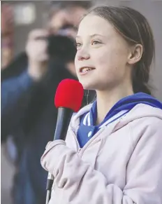  ?? MARC PISCOTTY/GETTY IMAGES ?? Swedish activist Greta Thunberg speaks at the Fridays For Future climate strike in Denver on Oct. 11. She will be at a rally outside the Vancouver Art Gallery starting at 11 a.m. Friday.