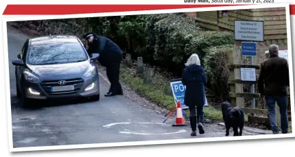  ?? ?? Tragic: Police patrol the area where a woman suffered a fatal dog attack in Caterham, Surrey