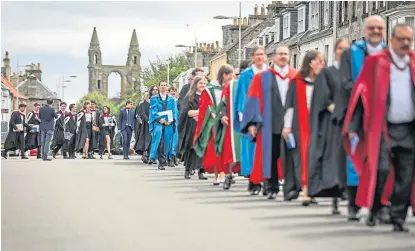  ?? Picture: Kim Cessford. ?? A St Andrews University procession to St Salvator’s Quad following one of the graduation ceremonies in June 2019.