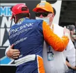  ?? Chris Graythen/Getty Images ?? Scott Dixon receives congratula­tions from team owner Chip Ganassi after winning July 4 on the Indianapol­is road course.