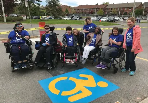  ?? PHOTO COURTESY OF EMILY GLOSSUP ?? Members of the The WE Club at the Children’s Hospital of Eastern Ontario (CHEO) in Ottawa, ON, gather to celebrate replacing the handicap logos at the hospital main entrance in June.