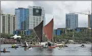  ?? AP/The Honolulu Advertiser/CRAIG T. KOJIMA ?? The Polynesian Voyaging Society’s Hokulea sailing canoe arrives Saturday at Magic Island in Honolulu.