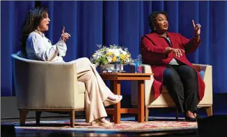  ?? JOHN DAVID SCARCLIFF/TOBIN CENTER ?? Stacey Abrams (right) avoided mention of her loss to Republican Brian Kemp in 2018 and said nothing of a political comeback next year on Monday in San Antonio. When someone called out that she’ll be governor one day, Abrams swallowed a smile and stayed quiet.