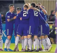  ?? Photograph­s by Scott Baxter ?? One up: Mitch Megginson is mobbed after scoring Cove’s opener.