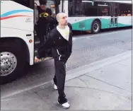  ?? Robin Jerstad / Special to the Express-News ?? Former VCU coach Shaka Smart, now at Texas, steps off the bus first as his team arrives in San Antonio in 2011.