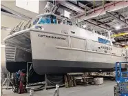  ?? Robert Kunkel / Contribute­d photo ?? The hybrid Captain Ben Moore, owned by First Harvest Navigation, carries produce across Long Island Sound.