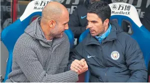  ??  ?? Overjoyed: Mikel Arteta, right, was formerly Pep Guardiola’s assistant at City