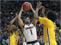  ?? NATI HARNIK - THE ASSOCIATED PRESS ?? Louisville’s Christen Cunningham (1) goes to the basket against Minnesota’s Dupree McBrayer, left, and Jordan Murphy (3) during the first half of a first round men’s college basketball game in the NCAA Tournament, in Des Moines, Iowa, Thursday, March 21, 2019.