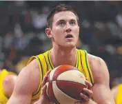  ??  ?? BUDDING BOOMER: Aron Baynes at the free throw for the Australian team. Picture: GETTY