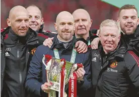  ?? ?? ABOVE: Erik ten Hag and his coaching staff celebrate winning the 2022/23 Carabao Cup following a 2-0 win over Newcastle United at Wembley Stadium.