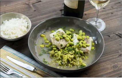  ?? CHEYENNE COHEN/KATIE WORKMAN VIA AP ?? This 2018 photo provided by Katie Workman shows a dish of cod, cabbage and edamame taken in New York. Cabbage, that taken-for-granted vegetable, that sturdy, dense staple of many a poor, ancestral homeland, is finally getting respect.