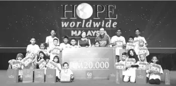  ??  ?? In conjunctio­n with its 40th Anniversar­y Celebratio­n, Faber-Castell Malaysia has also donated a total amount of RM20,000 to support Hope Worldwide’s Reading and Creative Art Programme for children aged between seven to 12 years old.