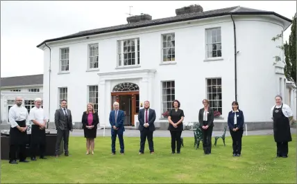  ??  ?? Pictured is Paul Walsh of Springfort Hall with members of the Staff ready to welcome guests back again.