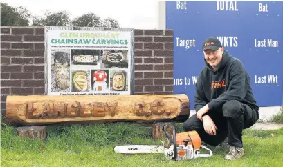  ??  ?? ●● The wood carving donated by Glen Urquhart of Glen Urquhart Chainsaw Carvings