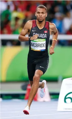  ??  ?? BELOW McBride racing at the Rio Olympics